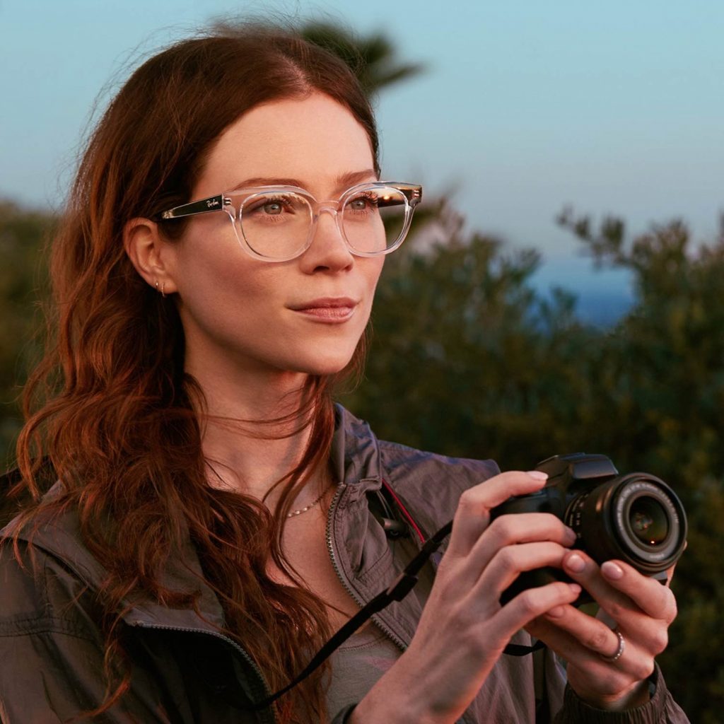 Image of Woman with Glasses with a Camera