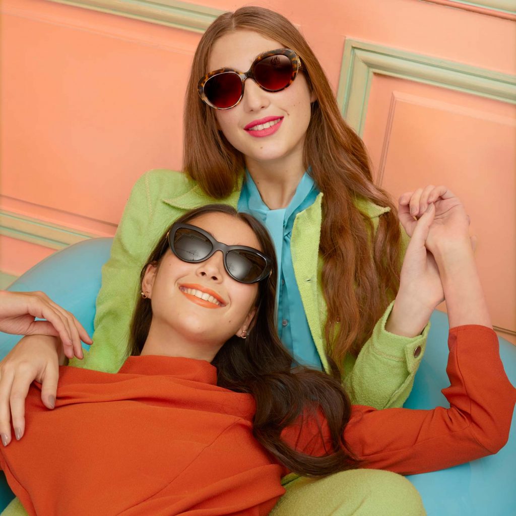 Image of Two Woman Wearing Designer Sunglasses