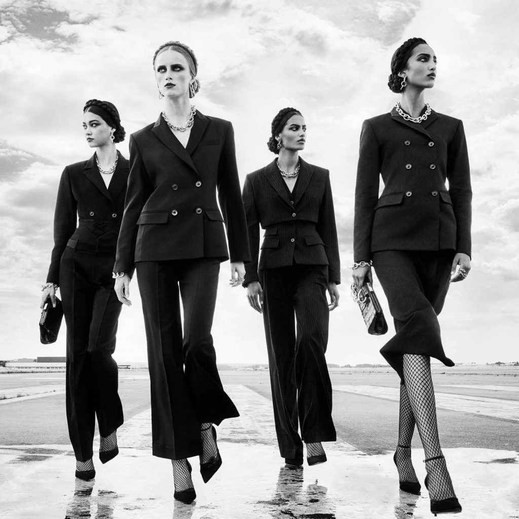 Image of Four Women in Black Suits