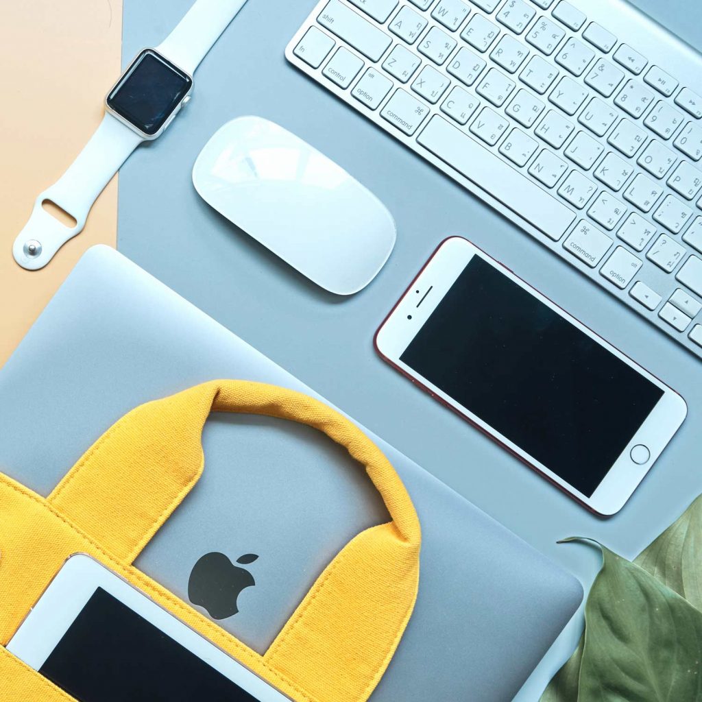 Image of Mac laptop computer, iPhone, and Apple Watch