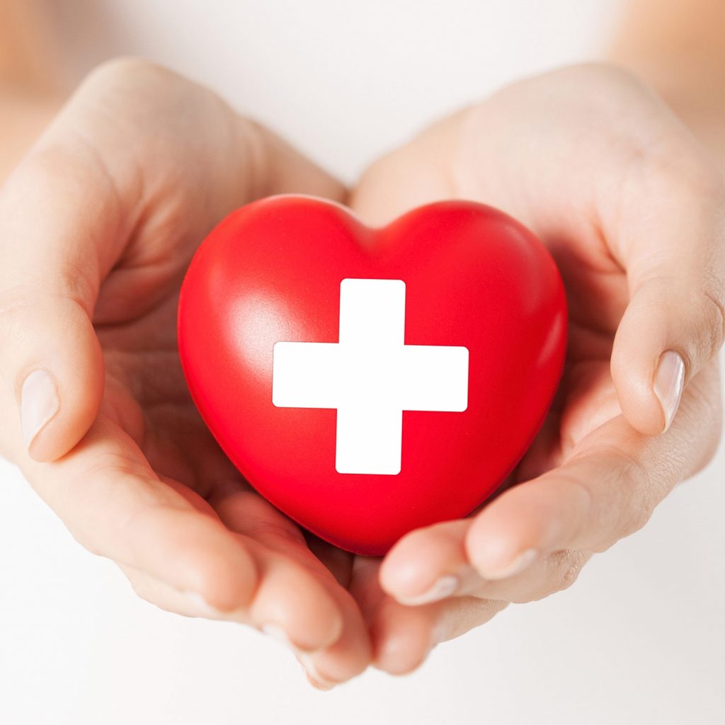 Image of Hands Holding American Red Cross Heart