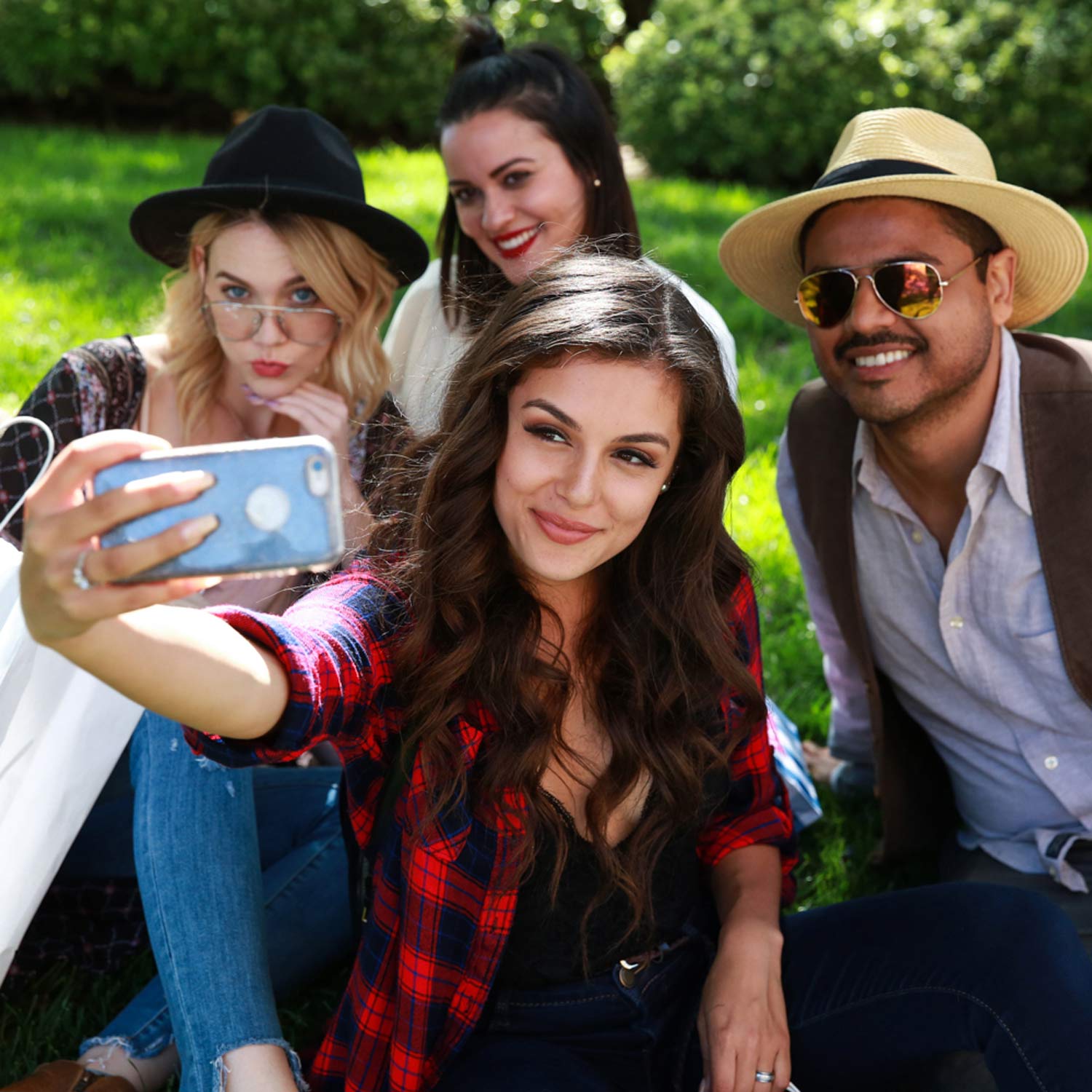 Image of Three Women and One Man Taking A Selfie on the FIGat7th Plaza