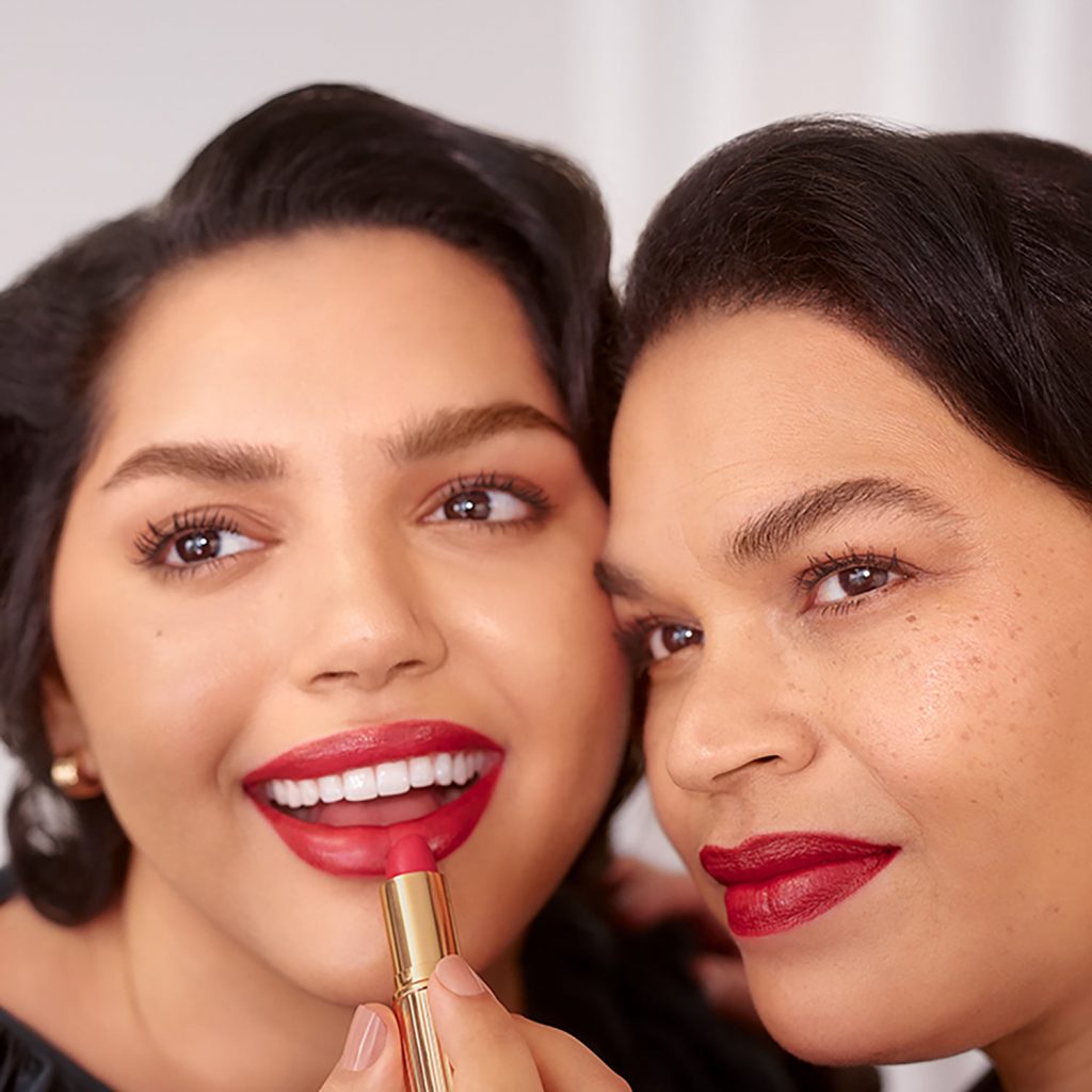 Image of Woman Applying Red Lipstick