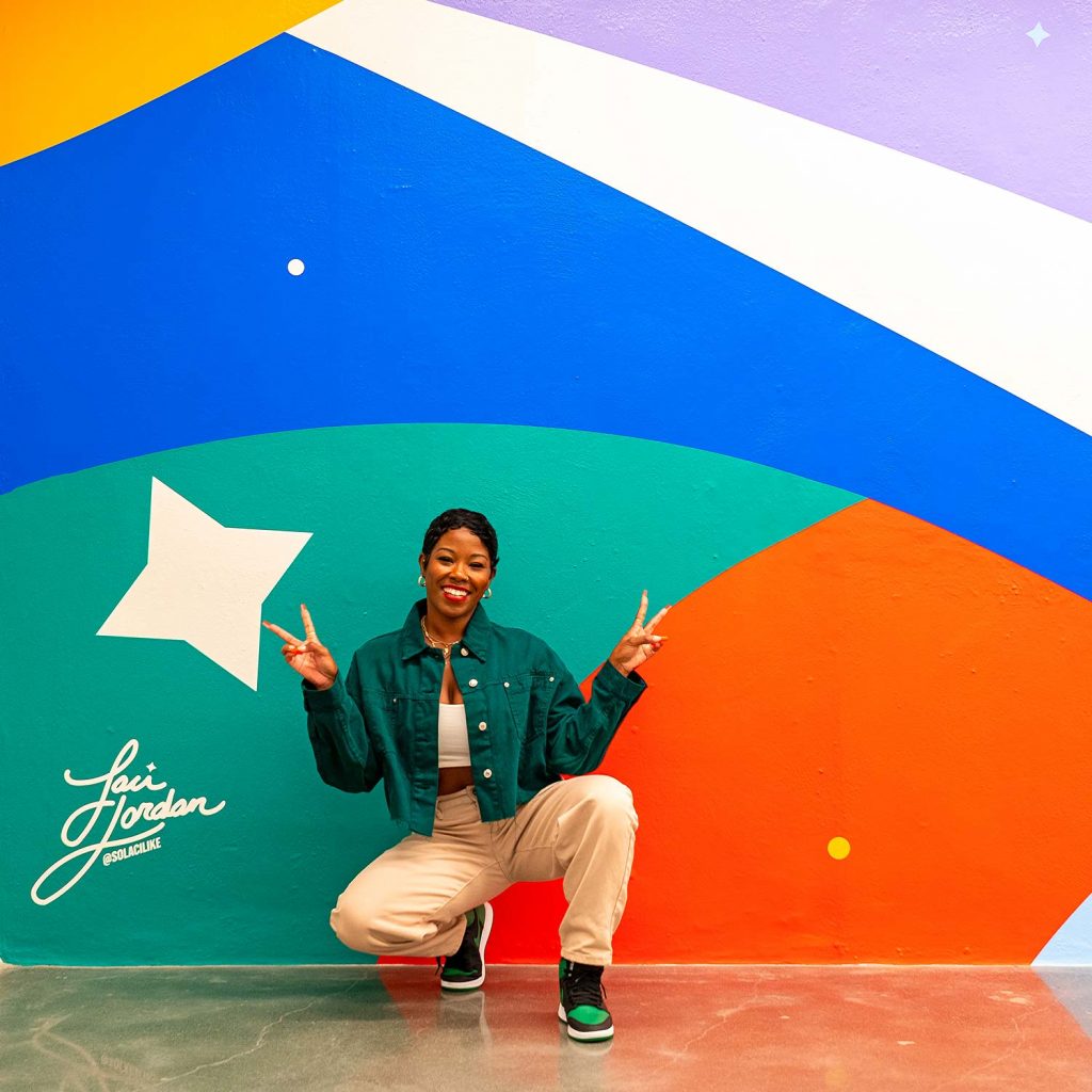 Image of Laci Jordan with Tunnel of Dreams Mural