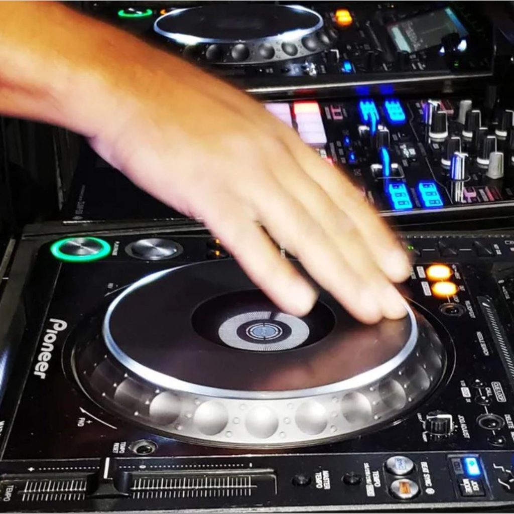 Image of hand on DJ turntable